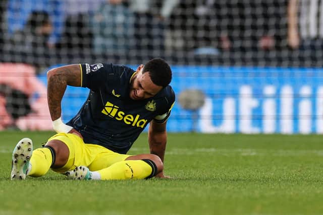 Newcastle United's English defender #06 Jamaal Lascelles reacts following an injuree during the English Premier League football match between Luton Town and Newcastle United at Kenilworth Road in Luton, north of London on December 23, 2023