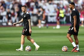 Newcastle United's English defender #02 Kieran Trippier (L) and Newcastle United's English striker #09 Callum Wilson. (Photo by HENRY NICHOLLS/AFP via Getty Images)