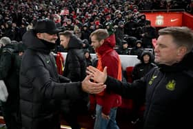 Jurgen Klopp manager of Liverpool with Eddie Howe manager of Newcastle United at the start of the Premier League match between Liverpool FC and Newcastle United at Anfield on January 01, 2024 in Liverpool, England. 