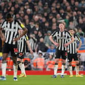 Sean Longstaff of Newcastle United looks dejected after Curtis Jones of Liverpool (not pictured) scores their sides second goal during the Premier League match between Liverpool FC and Newcastle United at Anfield on January 01, 2024 in Liverpool, England. 