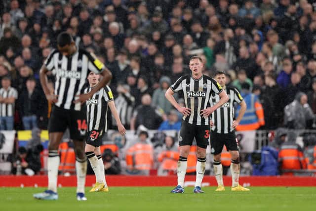 Sean Longstaff of Newcastle United looks dejected after Curtis Jones of Liverpool (not pictured) scores their sides second goal during the Premier League match between Liverpool FC and Newcastle United at Anfield on January 01, 2024 in Liverpool, England. 