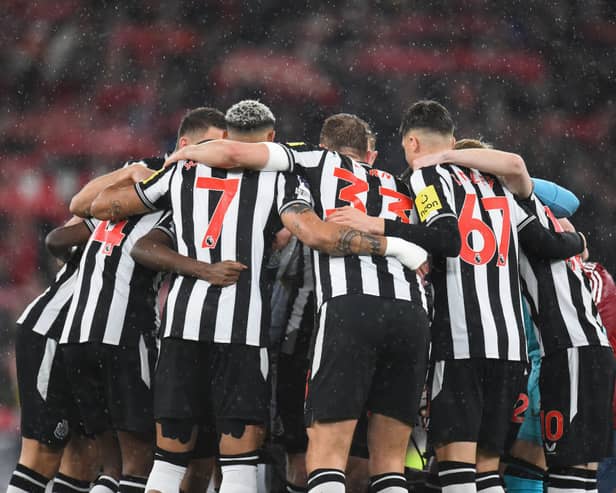 Newcastle players form a group huddle ahead of kick-off in the English Premier League football match between Liverpool and Newcastle United at Anfield in Liverpool, north west England on January 1, 2024. (Photo by PETER POWELL / AFP)