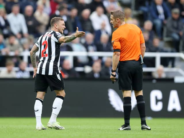 Kieran Trippier of Newcastle United interacts with Match Referee Craig Pawson during the Premier League match between Newcastle United and Brentford FC. (Photo by George Wood/Getty Images)
