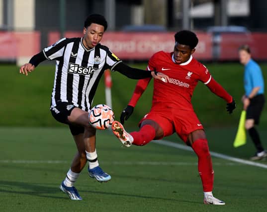 Keyrol Figueroa of Liverpool and Travis Hernes of Newcastle United. (Photo by Nick Taylor/Liverpool FC/Liverpool FC via Getty Images)