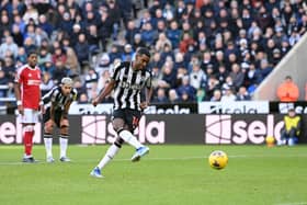 Alexander Isak of Newcastle United scores their sides first goal from the penalty spot during the Premier League match between Newcastle United and Nottingham Forest at St. James Park on December 26, 2023 in Newcastle upon Tyne, England. 