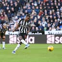 Alexander Isak of Newcastle United scores their sides first goal from the penalty spot during the Premier League match between Newcastle United and Nottingham Forest at St. James Park on December 26, 2023 in Newcastle upon Tyne, England. 