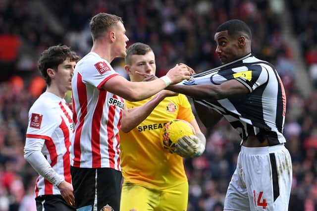 Daniel Ballard of Sunderland clashes with Alexander Isak of Newcastle United during the Emirates FA Cup Third Round match between Sunderland and Newcastle United at Stadium of Light. (Photo by Stu Forster/Getty Images)