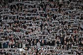 Newcastle fans hold scarves in the air during the Emirates FA Cup Third Round match against Sunderland (Photo by Michael Regan/Getty Images)