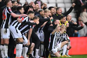 The Newcastle squad pose for a celebration picture after the Emirates FA Cup Third Round win over Sunderland. (Photo by Stu Forster/Getty Images)