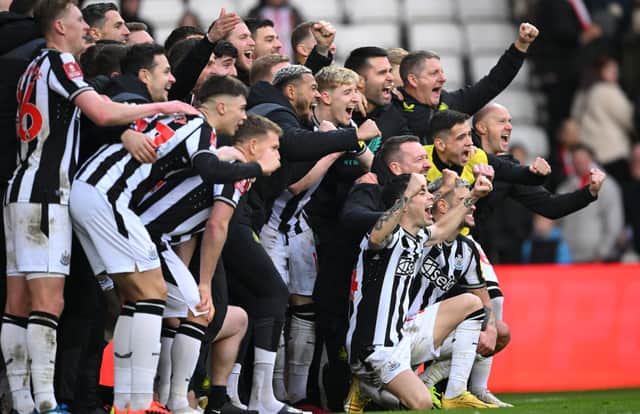The Newcastle squad pose for a celebration picture after the Emirates FA Cup Third Round win over Sunderland. (Photo by Stu Forster/Getty Images)
