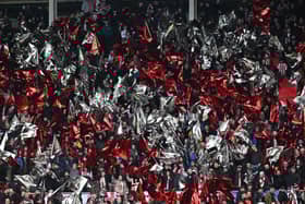 Sunderland fans build the atmosphere in the crowd ahead of the English FA Cup third round football match between Sunderland and Newcastle United at The Stadium of Light in Sunderland in north east England on January 6, 2024. 