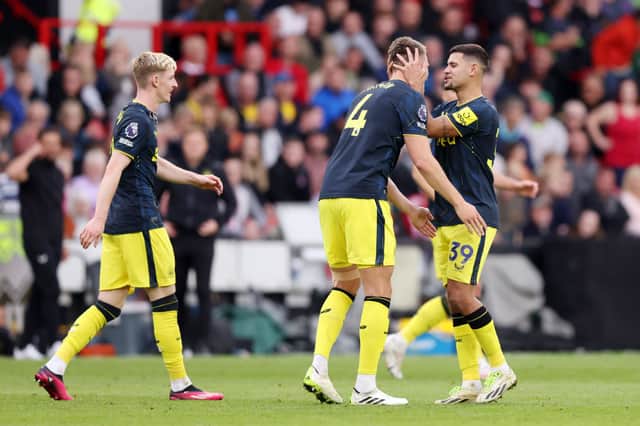Sven Botman celebrates with Bruno Guimaraes after scoring for Newcastle United against Sheffield United. (Photo by George Wood/Getty Images)