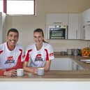 Howdens Game Changer Programme ambassadors Chris Kamara MBE and Jill Scott MBE in a grassroots football club kitchen