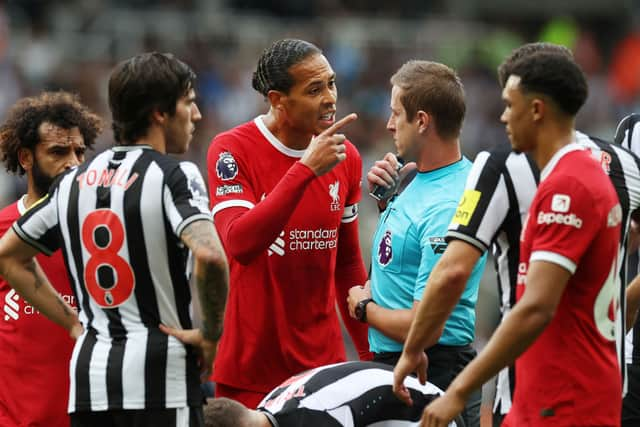 Liverpool defender Virgil van Dijk reacts to his red card against Newcastle United (Photo by Ian MacNicol/Getty Images)