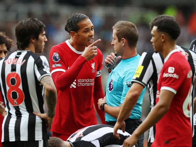 Liverpool defender Virgil van Dijk reacts to his red card against Newcastle United (Photo by Ian MacNicol/Getty Images)
