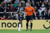 Alexander Isak of Newcastle United speaks to Referee, Thomas Bramall during the Premier League match between Newcastle United and Burnley FC, (Photo by Ian MacNicol/Getty Images)