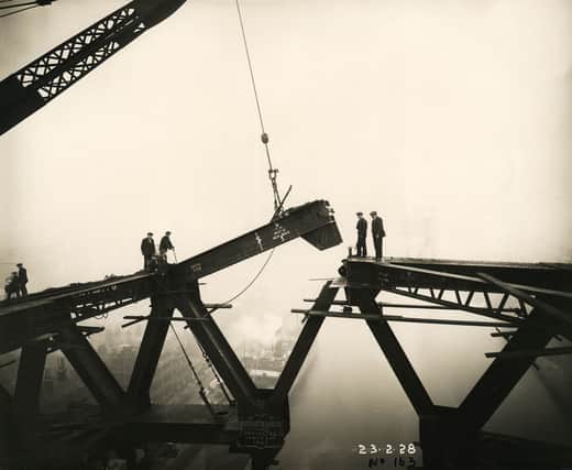The Tyne Bridge arch is nearly complete as a girder is lowered into place above the River Tyne, 23 February 1928 