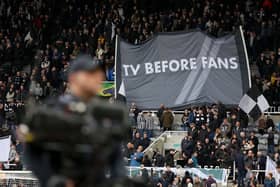 Newcastle United fans hold up a banner reading 'TV BEFORE FANS' prior to the Premier League match between Newcastle United and Luton Town at St. James Park. (Photo by George Wood/Getty Images)