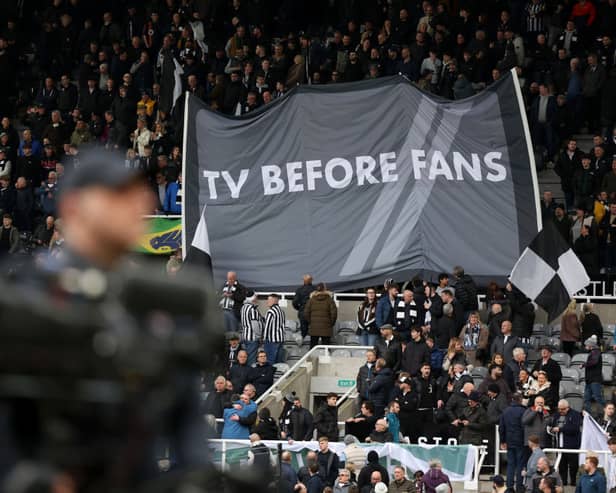 Newcastle United fans hold up a banner reading 'TV BEFORE FANS' prior to the Premier League match between Newcastle United and Luton Town at St. James Park. (Photo by George Wood/Getty Images)
