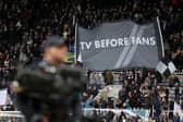 Newcastle United fans hold up a banner reading 'TV BEFORE FANS' prior to the Premier League match between Newcastle United and Luton Town at St. James Park. (Photo by George Wood/Getty Images)