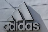 The company logo of Germany's sports equipment maker Adidas is seen on a building in Herzogenaurach, southern Germany, on July 3, 2023. (Photo by Christof STACHE / AFP) 