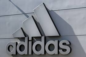The company logo of Germany's sports equipment maker Adidas is seen on a building in Herzogenaurach, southern Germany, on July 3, 2023. (Photo by Christof STACHE / AFP) 