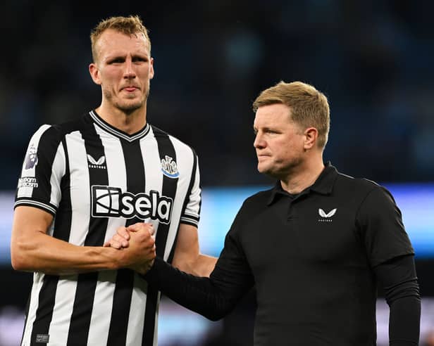 Newcastle United defender Dan Burn (left) and head coach Eddie Howe (right). (Photo by Stu Forster/Getty Images)