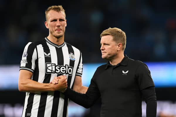 Newcastle United defender Dan Burn (left) and head coach Eddie Howe (right). (Photo by Stu Forster/Getty Images)