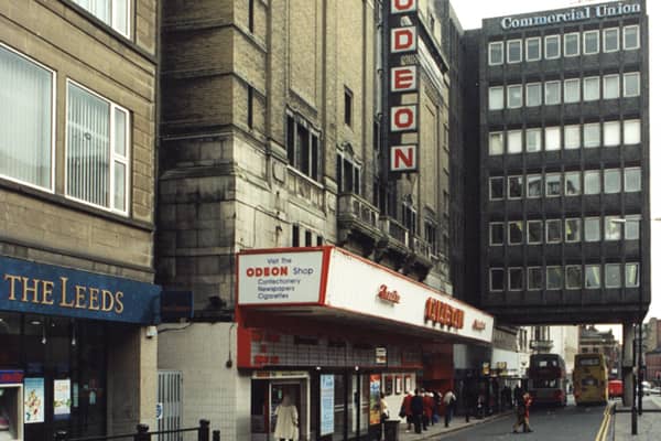 A 1995 photograph of the exterior of the Odeon cinema on Pilgrim Street Newcastle upon Tyne. The photograph has been taken from the top of Pilgrim Street looking down to the Odeon which is centre left. The Commercial Union building which straddles the road is beyond the Odeon. Part of the premises of The Leeds building society can be seen in the foreground to the left. 