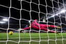 Martin Dubravka of Newcastle United fails to save a penalty taken by Cole Palmer of Chelsea during a penalty shoot out in the Carabao Cup Quarter Final match. (Photo by Julian Finney/Getty Images)