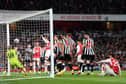 Gabriel of Arsenal heads a shot which is later deflected by Sven Botman of Newcastle United, resulting in an own-goal and Arsenal's first goal. (Photo by David Price/Arsenal FC via Getty Images)