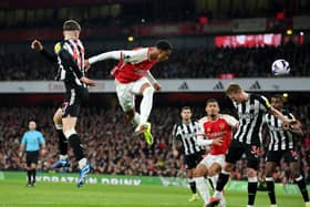 Gabriel of Arsenal heads a shot which is later deflected by Sven Botman of Newcastle United (not pictured), resulting in an own-goal and Arsenal's first goal during the Premier League match between Arsenal FC and Newcastle United at Emirates Stadium on February 24, 2024 in London, England.