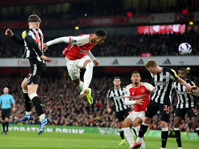 Gabriel of Arsenal heads a shot which is later deflected by Sven Botman of Newcastle United (not pictured), resulting in an own-goal and Arsenal's first goal during the Premier League match between Arsenal FC and Newcastle United at Emirates Stadium on February 24, 2024 in London, England.
