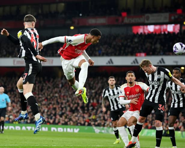 Gabriel of Arsenal heads a shot which is later deflected by Sven Botman of Newcastle United (not pictured), resulting in an own-goal and Arsenal's first goal during the Premier League match between Arsenal FC and Newcastle United at Emirates Stadium on February 24, 2024 in London, England.
