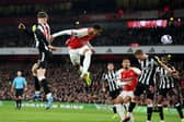 Gabriel of Arsenal heads a shot which is later deflected by Sven Botman of Newcastle United (not pictured), resulting in an own-goal and Arsenal's first goal during the Premier League match between Arsenal FC and Newcastle United at Emirates Stadium on February 24, 2024 in London, England.