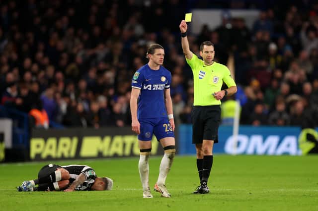 Chelsea midfielder Conor Gallagher is shown a yellow card by referee Jarred Gillett against Newcastle United. (Photo by Julian Finney/Getty Images)