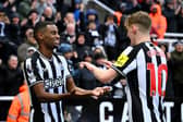 Alexander Isak of Newcastle United celebrates scoring his team's first goal with teammate Anthony Gordon during the Premier League match between Newcastle United and Wolverhampton Wanderers at St. James Park on March 02, 2024 in Newcastle upon Tyne, England.