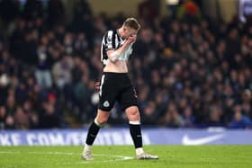 Sean Longstaff of Newcastle United reacts during the Premier League match between Chelsea FC and Newcastle United at Stamford Bridge on March 11, 2024 in London, England.