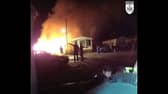 Bodycam footage shows heroic police response to a large caravan fire in Cranbourne.