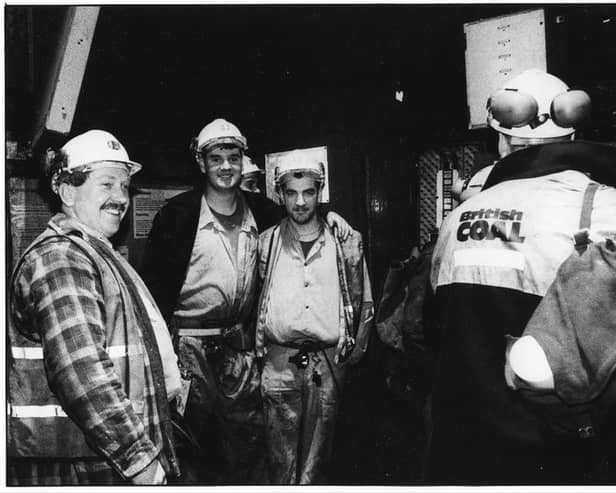 A group of miners sharing a joke at Wearmouth Colliery on the last week of production before closure- November 1993.