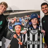 Anthony Gordon and Bruno Guimarães with young Tyler.