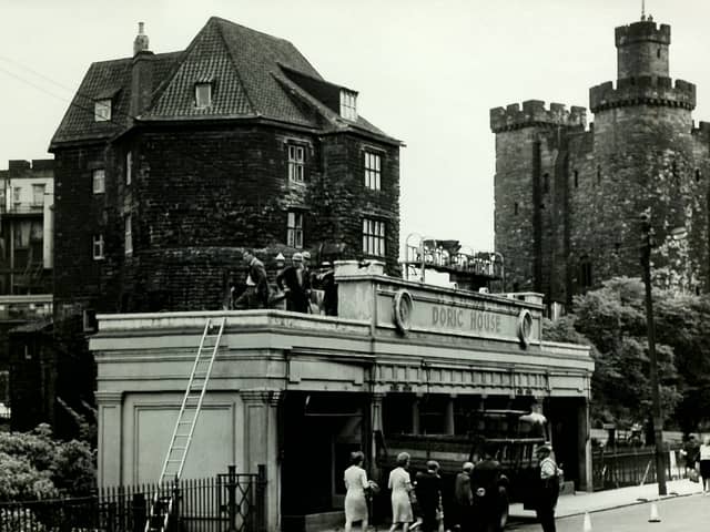 Doric House in front of the Castle Keep in 1966. The building opened in 1922 as a shop and was demolished in the 1970s. 