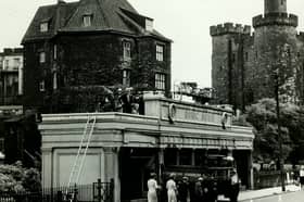 Doric House in front of the Castle Keep in 1966. The building opened in 1922 as a shop and was demolished in the 1970s. 