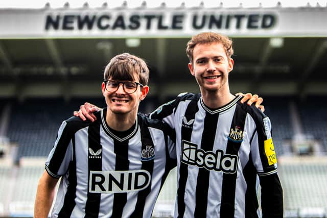 Newcastle United fans David Wilson and Ryan Gregson unveil Sela’s haptic shirts that will for the first time enable deaf fans to feel the atmosphere of the crowd inside St. James’ Park for Premier League game with Tottenham Hotspur on Saturday April 13. Sela will also donate its front-of-shirt logo placement and pitch side advertising rights to major deaf and hearing loss charity RNID for the game. Photo credit: Lucy Ray/PA Media