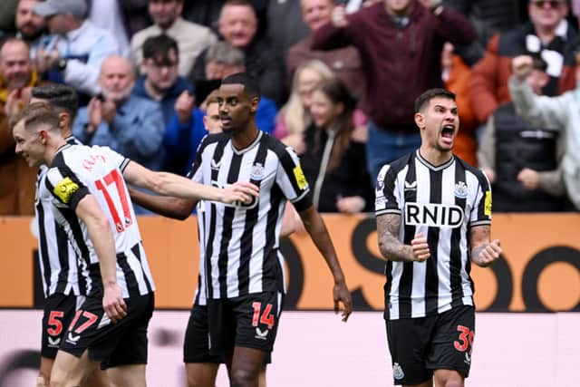 Bruno Guimaraes of Newcastle United celebrates after teammate Alexander Isak scores the team's third goal during the Premier League match between Newcastle United and Tottenham Hotspur at St. James Park on April 13, 2024 in Newcastle upon Tyne, England. 
