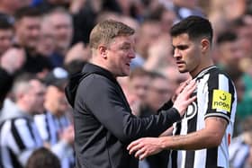 Newcastle United midfielder Bruno Guimaraes and head coach Eddie Howe. (Photo by Stu Forster/Getty Images)