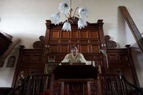 Wayne Colquhoun stands at the pulpit in the former Chapel Salem.