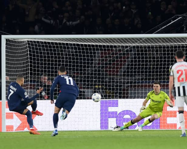  Kylian Mbappe of Paris Saint-Germain scores the team's first goal from a penalty kick during the UEFA Champions League match vs Newcastle United. (Photo by Justin Setterfield/Getty Images)