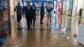 Water was seen gushing from the ceiling of shop after it partially collapsed due to heavy rain.
