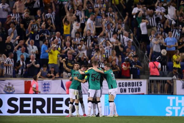 Elliot Anderson of Newcastle United celebrates with teammates after scoring their team's second goal  during the Premier League Summer Series match between Brighton & Hove Albion and Newcastle United at Red Bull Arena on July 28, 2023 in Harrison, New Jersey.